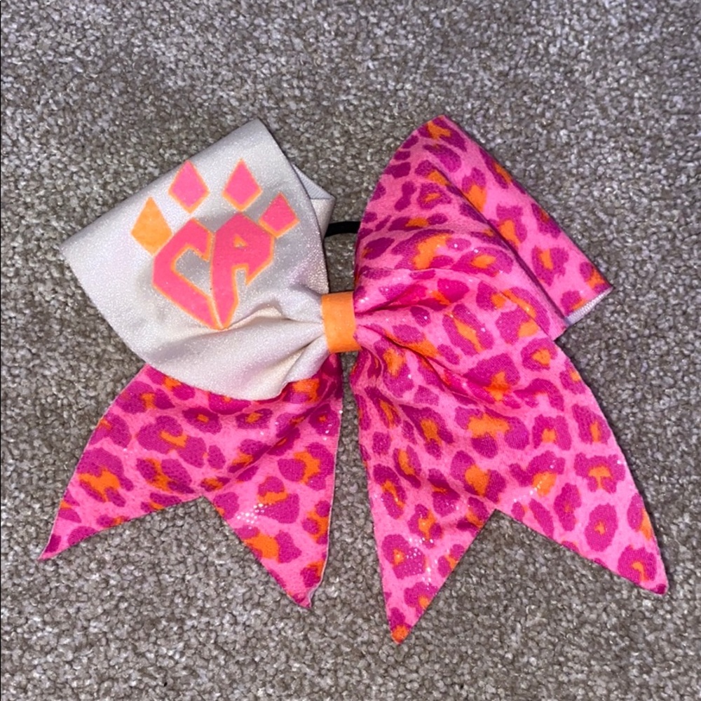 Cheer Athletics pink and orange neon bow